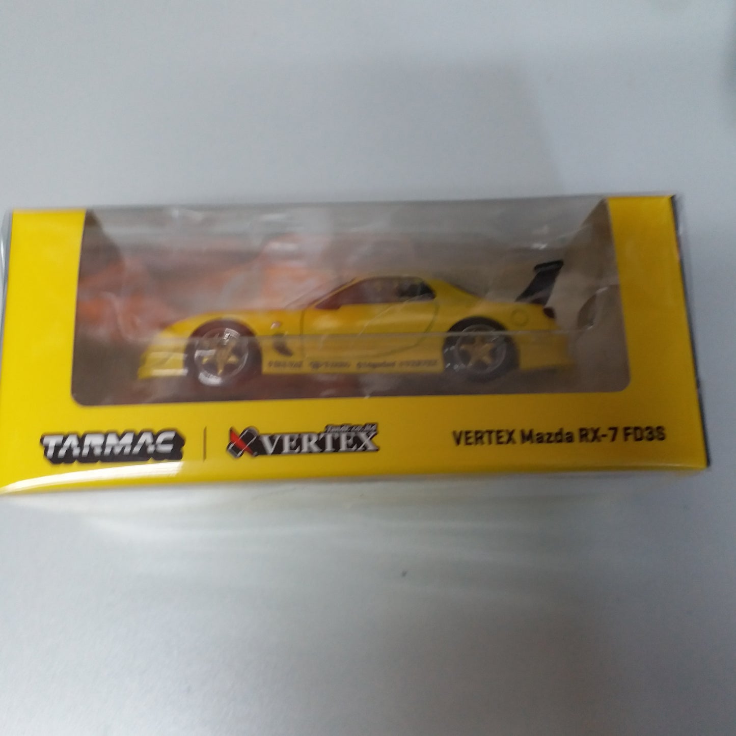 Tarmac Works 1:64 Scale VERTEX Mazda RX-7 FD3S Yellow Metallic